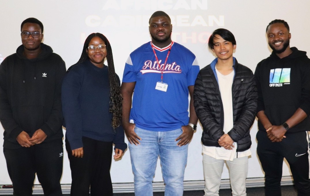 Group photo of participants presenting