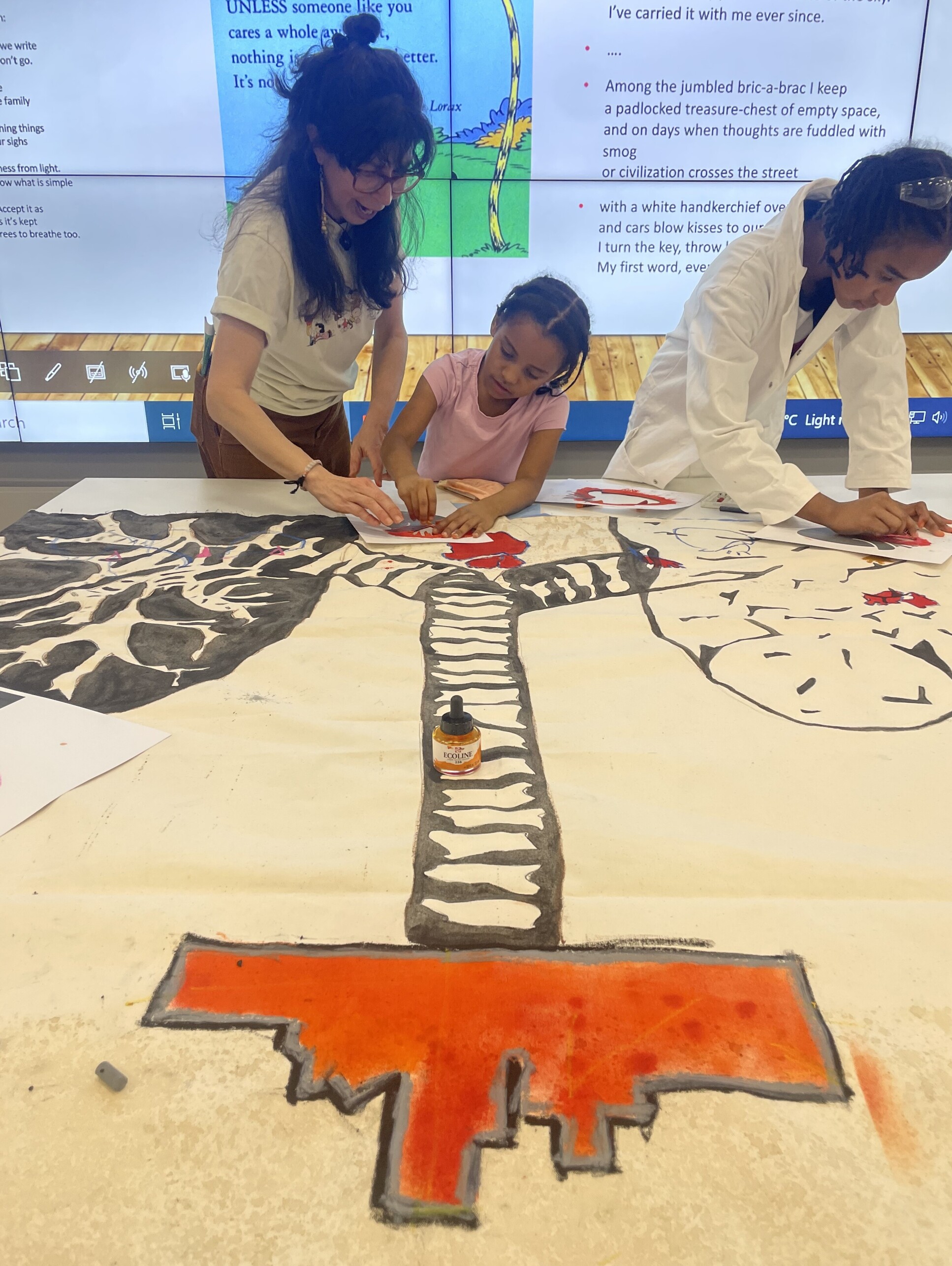 Artist Elizabeth Salazar working with children